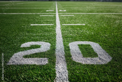 Vibrant Green Football Field with White 20 Yard Line Marker.
