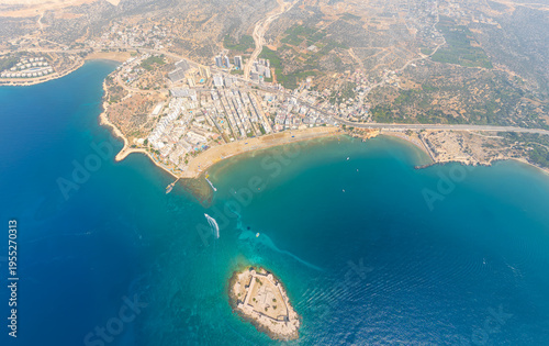 Wallpaper Mural Kizkalesi, Mersin, Turkey. Aerial drone view of Kizkalesi island castle overlooking lively beaches packed with holidaymakers, blue Mediterranean Sea and city skyline. Aerial view Torontodigital.ca