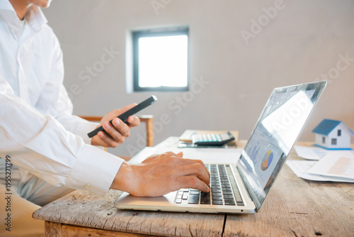 Real estate agents and clients are smiling and discussing property sales contracts, mortgages, investments, signing documents, purchase planning, ownership, and successful home sales transactions.