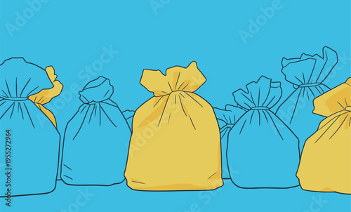 Different colored garbage bags are lined up against a blue background during a recycling event at a community center