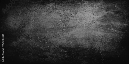 Aged dark grunge wall background with a vintage black textured stone pattern and rough grey concrete surface design