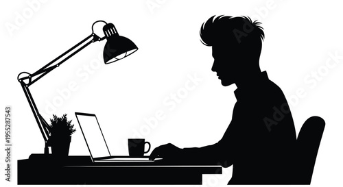 Silhouette of a man working on a laptop with a desk lamp