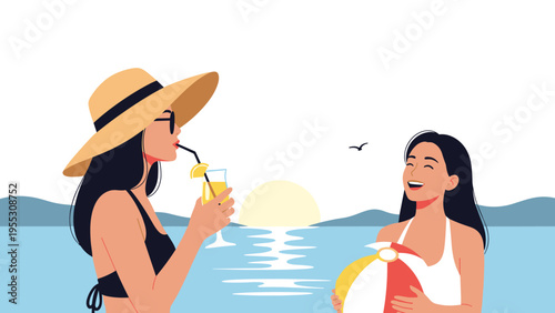 Two stylish young women enjoying a summer evening on the beach at sunset with one drinking a cocktail and the other holding a ball.