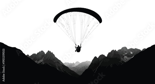 Silhouette of a paraglider soaring high above rugged mountain peaks in stark contrast