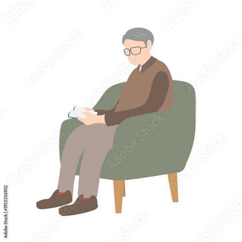 椅子に座って本を読むシニア男性 高齢者の読書シーン