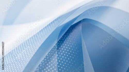 Abstract blue and white flowing lines with subtle dotted patterns creating a dynamic visual background.