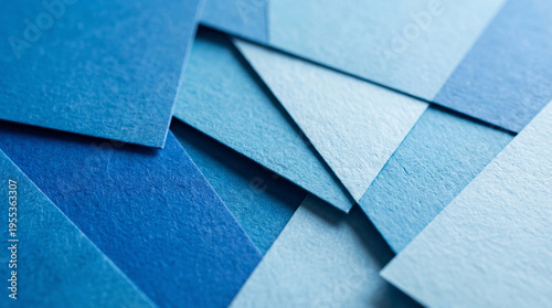 Tableau sur toile Photograph showcasing an array of overlapping textured blue paper squares arranged geometrically