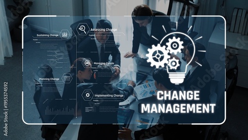 Принти на полотні Group of professionals engaged in a business meeting discussing change management strategies with visual aids, promoting collaboration for organizational success