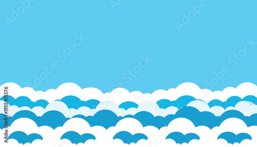 Ocean waves crash onshore under clear blue sky with white clouds