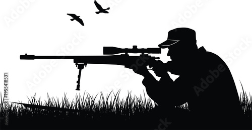 Silhouette of a professional sniper in a cap aiming a long-range rifle with a precision scope and bipod while crouching in tall grass under flying birds.
