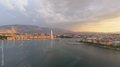 Golden evening over Geneva. Calm twilight at Geneva with reflections and mountain silhouette