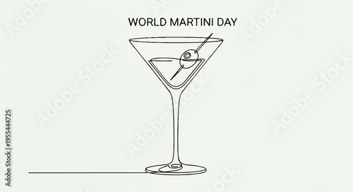 Martini glass with olive garnish on world martini day celebration background