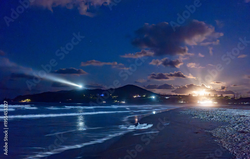 Byron Bay, beach with lighthouse by night