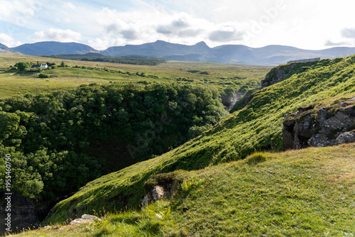 The Isle of Skye,  is a large and scenic island in the Inner Hebrides of Scotland. It's known for its dramatic landscapes.Ocean views from the Lealt Falls lookout
