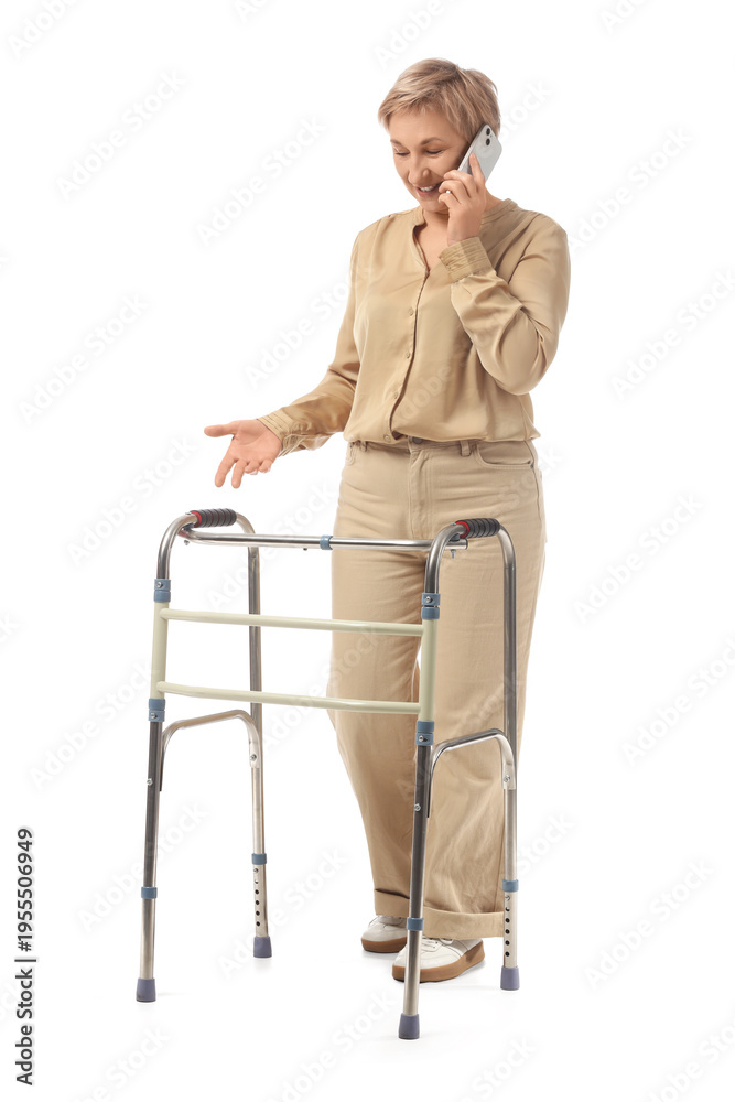 © Pixel-Shot - Mature woman with walking frame talking by mobile phone on white background © Pixel-Shot - Mature woman with walking frame talking by mobile phone on white background