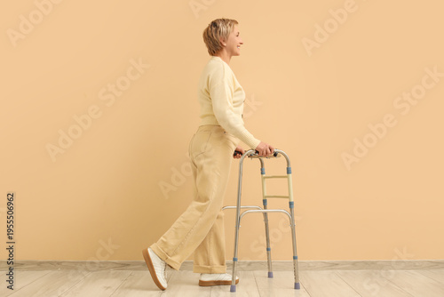 Mature woman using walker n...