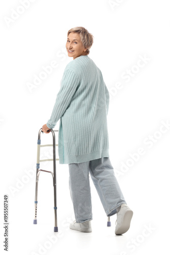Mature woman using walker o...