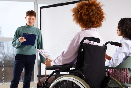 Young woman in wheelchair w...