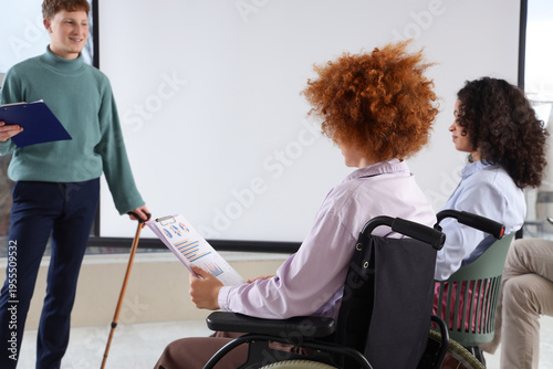 Young woman in wheelchair w...