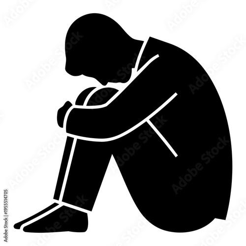 Depressed businessman sitting with knees hugged, feeling down
落ち込んで体操座りをするビジネスマン