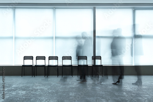 Silhouettes of moving busin...