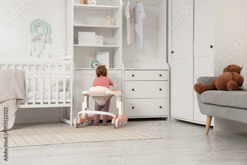 Cute little baby girl using...