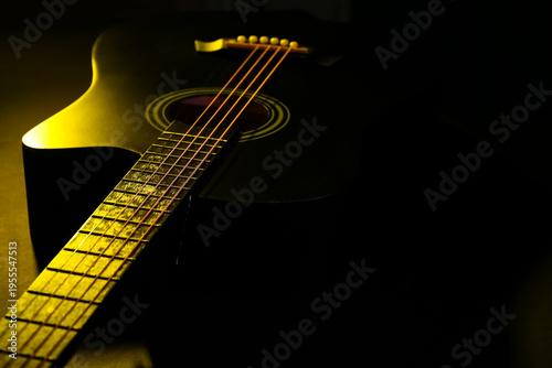 Acoustic guitar with yellow...