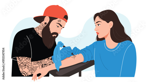 Bearded male tattoo artist with extensive body art carefully works on a tattoo on a young woman's arm using professional equipment in a shop.