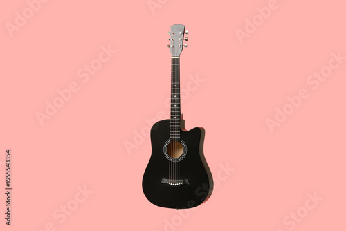Modern black guitar on pink...