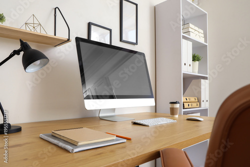 Workplace with blank comput...