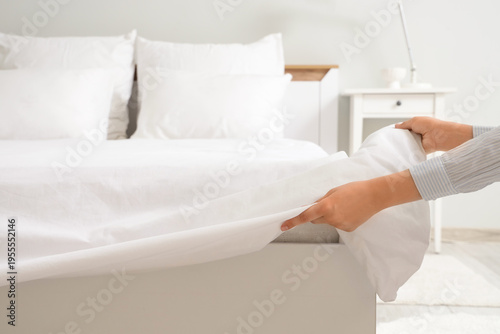 Female hands putting white ...