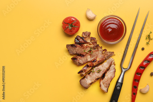 Cut grilled steak with toma...