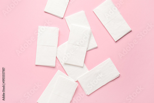 Paper napkins on pink backg...