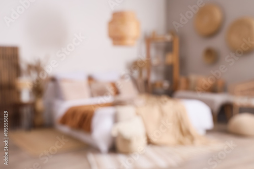 Blurred view of cozy bedroo...