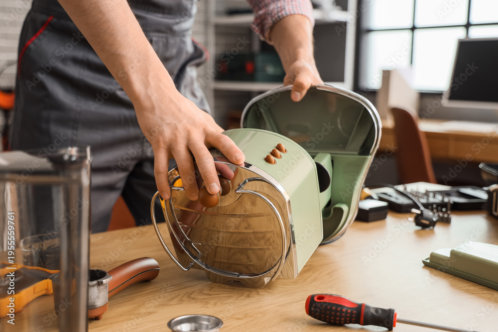 Ταπετσαρία Male worker repairing coffee machine at table in workshop, closeup