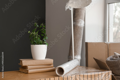 Cardboard boxes, lamp, roll...