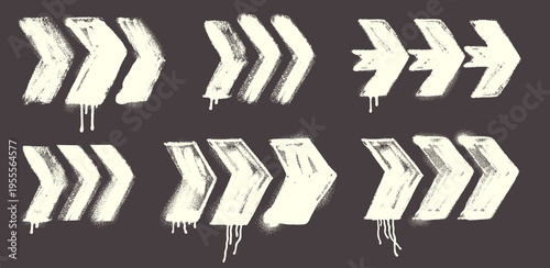 Set of arrow chevron stencil elements with black spray paint strokes. Grunge vector collection with rough edges, street art style marks, bold directional shapes and urban graffiti design elements.