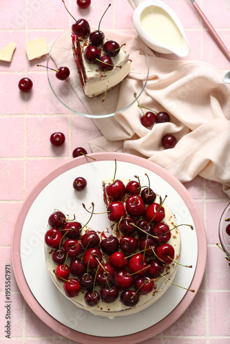 Tasty cherry cake on pink t...