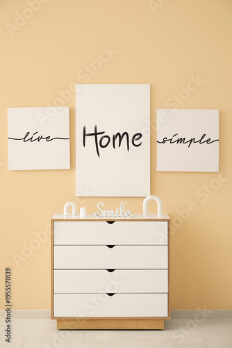 Chest of drawers near beige...