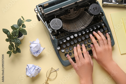 Woman typing on typewriter ...