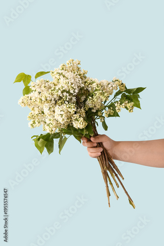 Female hand with bouquet of...