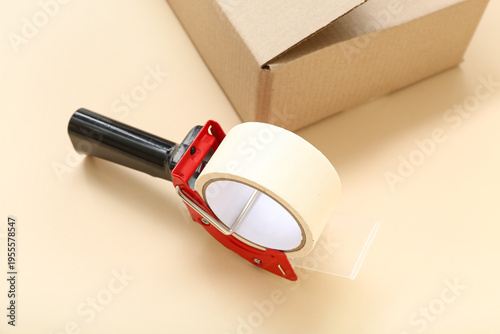 Packing tape dispenser and ...