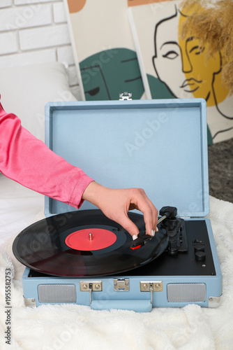 Young woman with record pla...