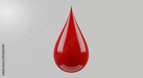 Vivid red drop on a neutral background, highlighting the essence of fluidity and form