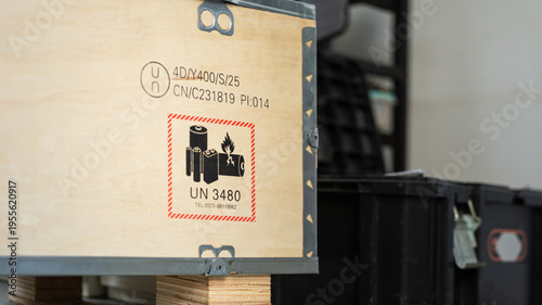 Fotografía Safety label and placard of high voltage battery or electronic component equipment in the wooden crate, safety sign for dangerous good transportation