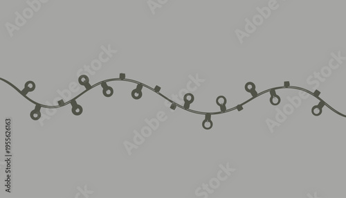 A string of Christmas lights on a gray background.