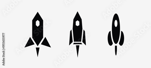 Three black silhouette rocket ships taking off