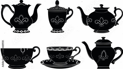 A set of elegant black and white tea cups and teapots with floral designs