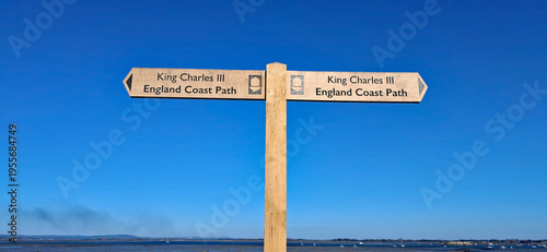 Wooden fingerpost sign for the King Charles III Coastal Path