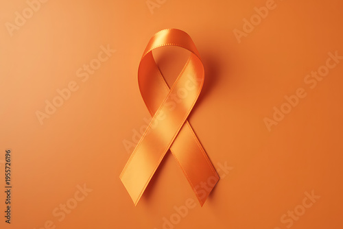 World Multiple Sclerosis Day. Horizontal banner. Copy space. Orange ribbon on a orange background for leukemia, kidney cancer, multiple sclerosis RSD awareness